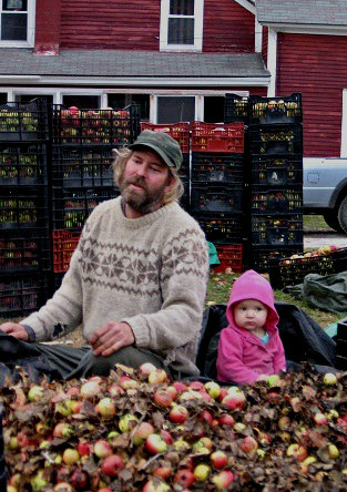 Ryan with one of his little sprouts during the cider apple harvest.